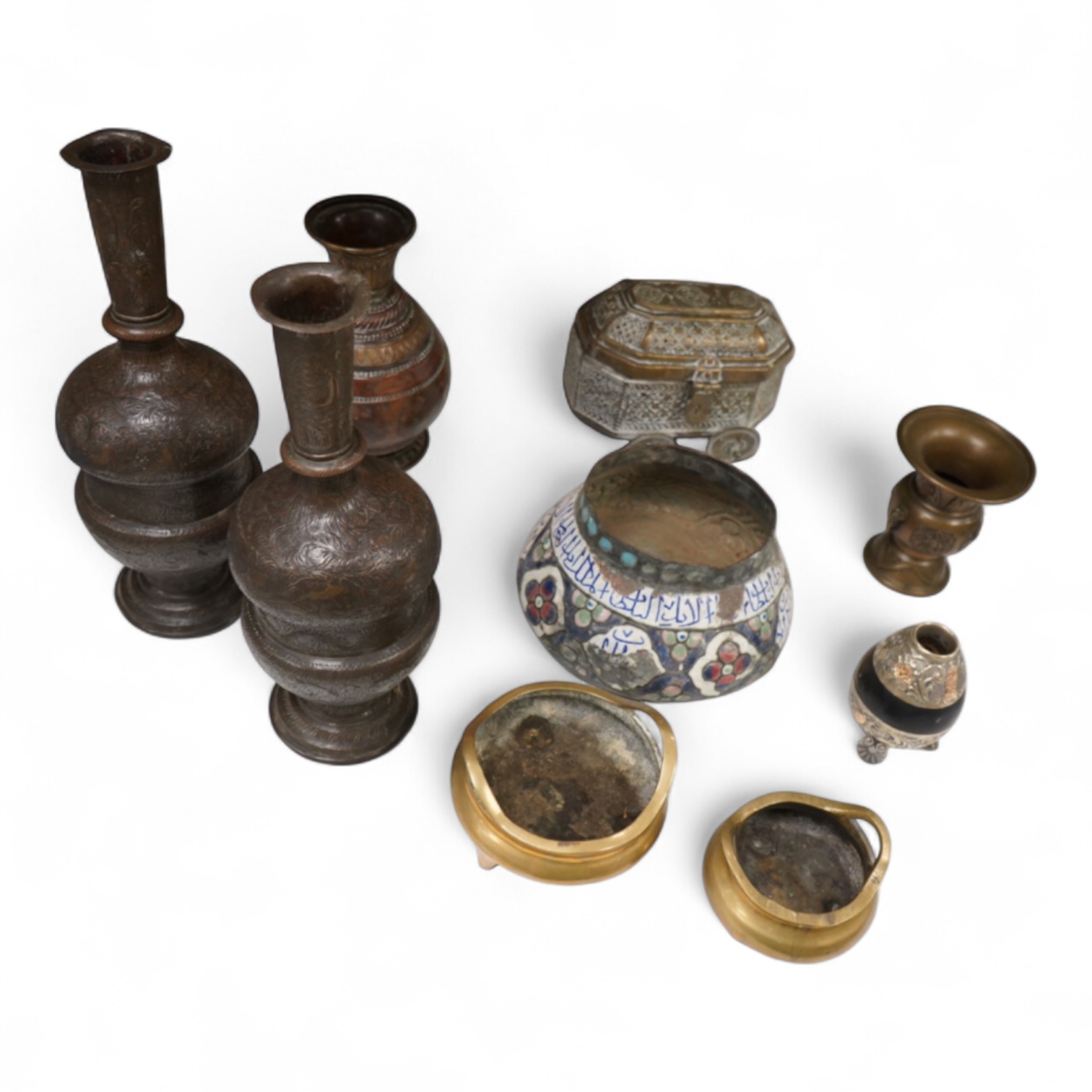A collection of Persian, Eastern and Chinese metalware to include two brass tripod censers, pair of vases and an enamel bowl, largest 33cm high